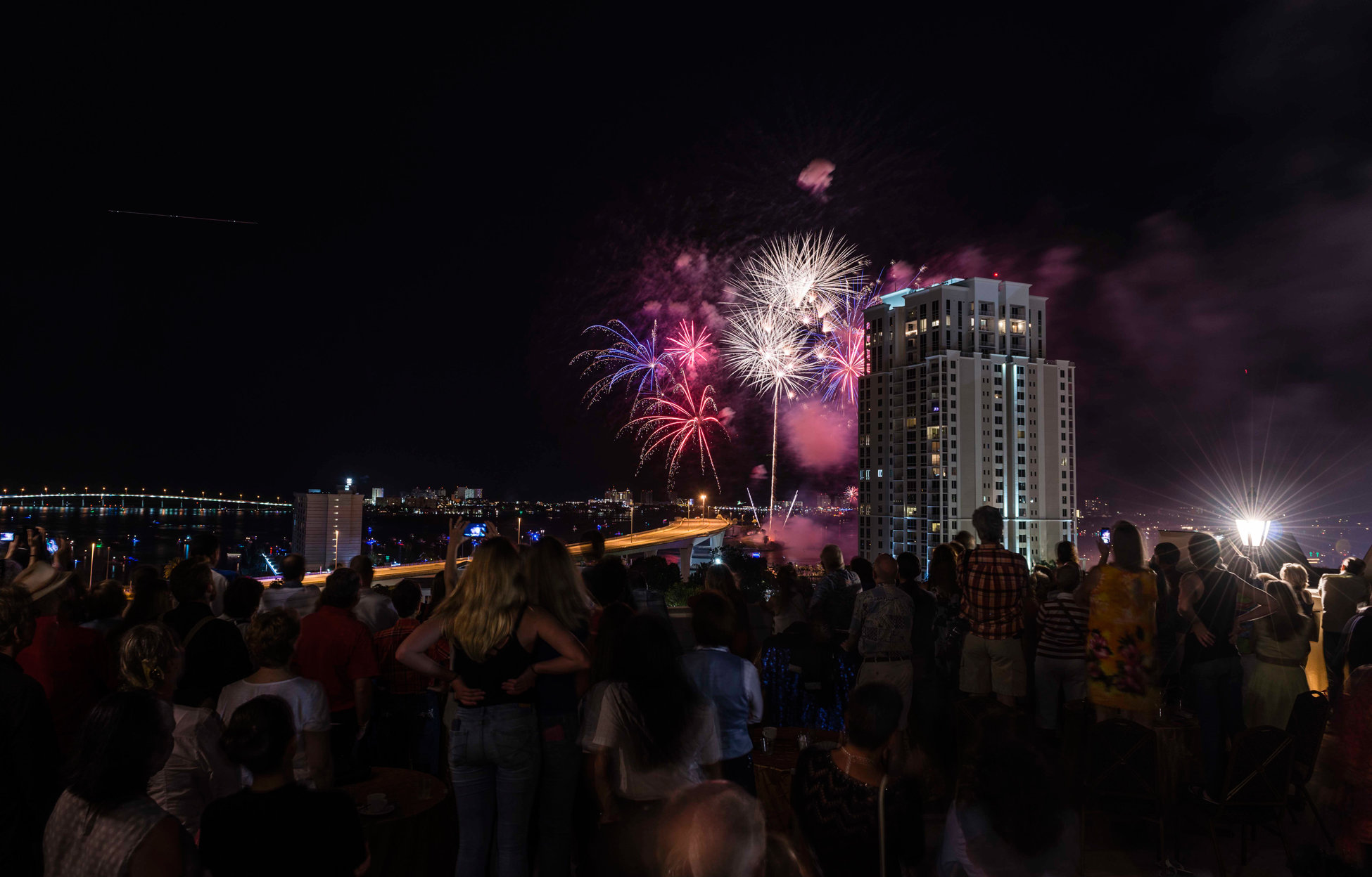 Guests enjoy Clearwater’s 4th of July fireworks from the 10th floor terrace of the Fort Harrison.
